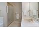 Bright bathroom featuring a glass-enclosed shower, and a sink with gold-tone fixtures at 1503 Jack White Dr, Rock Hill, SC 29732