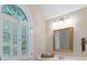 Bright bathroom vanity features a gold framed mirror, double doors leading to the backyard and fresh paint at 1503 Jack White Dr, Rock Hill, SC 29732