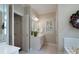 Bathroom features a vanity, a toilet, and a soaking tub with white tile at 1503 Jack White Dr, Rock Hill, SC 29732