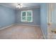 Bedroom with carpeted floor, a ceiling fan and a window with views of the surrounding outdoor area at 1503 Jack White Dr, Rock Hill, SC 29732