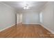Bright and airy bedroom featuring hardwood floors, a ceiling fan and neutral wall paint at 1503 Jack White Dr, Rock Hill, SC 29732