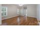 Spacious bedroom with hardwood floors, ceiling fan, and large windows with shutters at 1503 Jack White Dr, Rock Hill, SC 29732