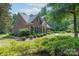 Well-maintained brick home with manicured lawn and lush shrubbery at 1503 Jack White Dr, Rock Hill, SC 29732
