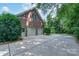 Spacious two-car garage attached to a brick home with an expansive concrete driveway at 1503 Jack White Dr, Rock Hill, SC 29732