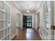 Bright foyer with hardwood floors and a black front door flanked by glass-paned doors at 1503 Jack White Dr, Rock Hill, SC 29732