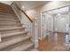 Bright foyer with hardwood floors featuring staircase, decorative glass door and entry with transom window at 1503 Jack White Dr, Rock Hill, SC 29732