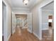 Inviting foyer featuring hardwood floors, elegant French doors, and views of the staircase at 1503 Jack White Dr, Rock Hill, SC 29732