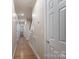Hallway features hardwood floors, recessed lighting, and white doors leading to other rooms at 1503 Jack White Dr, Rock Hill, SC 29732