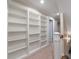 Upstairs hallway features custom built-in bookshelves, carpeted floor, fresh paint, and natural lighting at 1503 Jack White Dr, Rock Hill, SC 29732