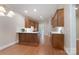 Well-lit kitchen featuring wood cabinets, modern appliances, and a hardwood floor at 1503 Jack White Dr, Rock Hill, SC 29732