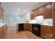 Well-lit kitchen with wooden cabinets, tile backsplash, and modern appliances at 1503 Jack White Dr, Rock Hill, SC 29732