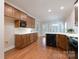 Spacious kitchen featuring wooden cabinets, white countertops, modern appliances, and hardwood floors at 1503 Jack White Dr, Rock Hill, SC 29732