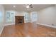 Cozy living room with hardwood floors, a fireplace, and a ceiling fan for added comfort at 1503 Jack White Dr, Rock Hill, SC 29732