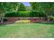 Brick monument sign for Meadow Lakes with colorful flower bed and manicured green lawn at 1503 Jack White Dr, Rock Hill, SC 29732