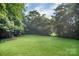 Extensive green backyard providing ample space for activities or relaxing at 1538 Hilltop Dr, Shelby, NC 28150