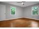 Comfortable bedroom with hardwood floors, two windows, and ample natural light at 1538 Hilltop Dr, Shelby, NC 28150
