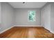 Cozy bedroom with hardwood floors, ample light, and neutral colors at 1538 Hilltop Dr, Shelby, NC 28150