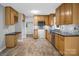 Well-lit kitchen featuring oak cabinets, stainless steel appliances, and tiled flooring at 1538 Hilltop Dr, Shelby, NC 28150