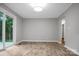 Bright living room with sliding glass door and views of the outdoor deck at 1538 Hilltop Dr, Shelby, NC 28150