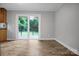 Bright living room with sliding glass door and views of the outdoor deck at 1538 Hilltop Dr, Shelby, NC 28150