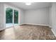 Bright living room with sliding glass door and views of the outdoor deck at 1538 Hilltop Dr, Shelby, NC 28150