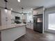 Modern kitchen featuring white cabinets, stainless steel appliances, and granite countertops at 1600 Russell Courtney Rd, Monroe, NC 28112