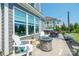 Outdoor patio with fire pit, comfortable seating, and a grill, perfect for entertaining guests and enjoying the outdoors at 19012 Beecher Commons Dr, Huntersville, NC 28078