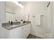Bright bathroom featuring double sinks, granite countertops, and modern fixtures for added convenience and style at 19012 Beecher Commons Dr, Huntersville, NC 28078