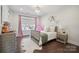 Charming bedroom with hardwood floors, soft lighting, and a cozy atmosphere at 19012 Beecher Commons Dr, Huntersville, NC 28078