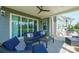 Relaxing covered patio featuring comfortable outdoor seating, a ceiling fan, and easy access to the outdoors at 19012 Beecher Commons Dr, Huntersville, NC 28078