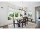 Charming dining area features a large window with natural light and a cozy bench seat at 19012 Beecher Commons Dr, Huntersville, NC 28078