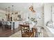 Bright dining area next to the kitchen, with a window seat and view of the backyard at 19012 Beecher Commons Dr, Huntersville, NC 28078