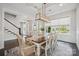 Bright dining room with coffered ceilings and large windows offering neighborhood views at 19012 Beecher Commons Dr, Huntersville, NC 28078