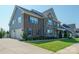 Gorgeous home with a three-car garage and a mix of brick and siding on the exterior at 19012 Beecher Commons Dr, Huntersville, NC 28078
