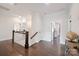 Upstairs hallway boasts hardwood floors and leads to the bedrooms and bathrooms at 19012 Beecher Commons Dr, Huntersville, NC 28078