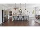Modern kitchen with stainless steel appliances, an island with seating, and sleek countertops at 19012 Beecher Commons Dr, Huntersville, NC 28078