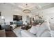 Open-concept living room with hardwood floors connects seamlessly to the modern kitchen at 19012 Beecher Commons Dr, Huntersville, NC 28078
