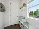 Well-organized mudroom with built-in bench, storage, and convenient access to the backyard at 19012 Beecher Commons Dr, Huntersville, NC 28078