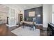 Comfortable office with French doors, built-in shelving, and a large window at 19012 Beecher Commons Dr, Huntersville, NC 28078