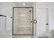 Modern tiled shower with glass door and built-in bench at 19012 Beecher Commons Dr, Huntersville, NC 28078