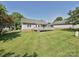 View of a backyard featuring a well-maintained lawn and a wooden deck attached to the house at 2912 Peachwood Ct, Fort Mill, SC 29715