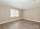 Bright bedroom with light-colored walls and laminate floors at 2912 Peachwood Ct, Fort Mill, SC 29715