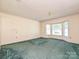 Spacious bedroom features large bay window and green carpeting at 2912 Peachwood Ct, Fort Mill, SC 29715