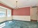 Elegant dining room featuring a classic chandelier, large windows, and decorative wall trim at 2912 Peachwood Ct, Fort Mill, SC 29715