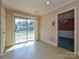 Classic dining room with patterned wallpaper and sliding glass door to deck at 2912 Peachwood Ct, Fort Mill, SC 29715