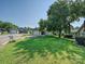 Street view of a house with a green front lawn and mature shade trees at 2912 Peachwood Ct, Fort Mill, SC 29715