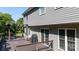 View of deck showcasing the gray vinyl siding on the house with an outdoor grill and seating at 2949 Glenstone Dr, Rock Hill, SC 29730