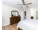 Bright bedroom featuring wood floors, white walls, a ceiling fan, and a wood dresser at 2949 Glenstone Dr, Rock Hill, SC 29730
