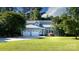 Charming gray home featuring a three-car garage and a well-manicured lawn and driveway at 2949 Glenstone Dr, Rock Hill, SC 29730