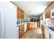 Bright kitchen featuring wood cabinets, a white refrigerator, and a view into the next room at 2949 Glenstone Dr, Rock Hill, SC 29730
